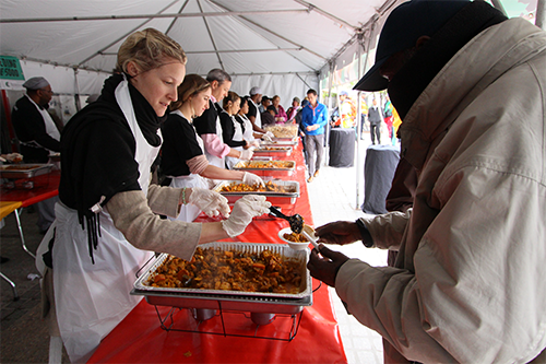 Women serving food to community - Food Donation