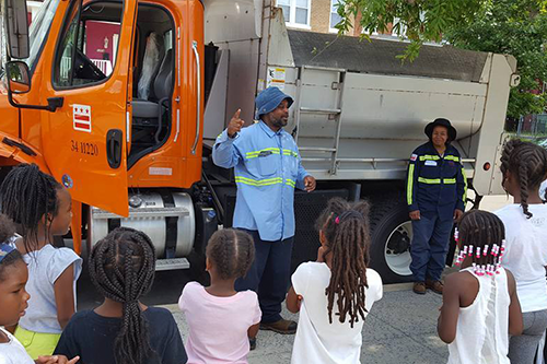 SWEEP inspector teaching kids about recycling through the SWEEP Jr. program