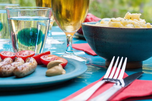 Picnic table with food and drinks